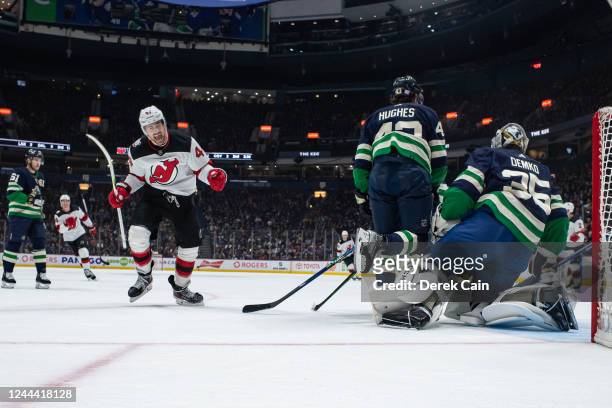Miles Wood of the New Jersey Devils celebrates after a goal by Michael McLeod of the New Jersey Devils on Thatcher Demko of the Vancouver Canucks of...