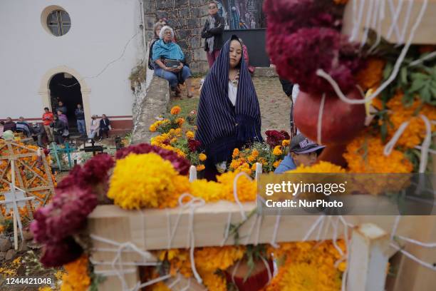 Several people attend the community pantheon of the Isla de Janitzio located in the state of Michoacán, Mexico, to clean the graves of their deceased...