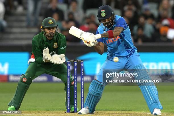 India's KL Rahul plays a shot watched by Bangladesh's wicketkeeper Nurul Hasan during the ICC men's Twenty20 World Cup 2022 cricket match between...