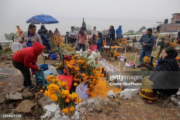 Several people attend the community pantheon of the Isla de Janitzio located in the state of Michoacán, Mexico, to clean the graves of their deceased...