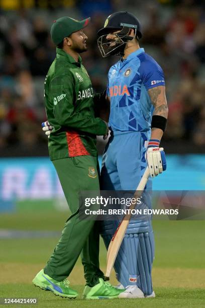 India's Virat Kohli talks to Bangladesh's Captain Shakib Al Hasan during the ICC men's Twenty20 World Cup 2022 cricket match between India and...