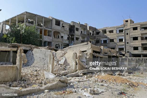 General view shows damaged buildings at the Yarmuk refugee camp in the southern suburbs of the Syrian capital Damascus on November 2, 2022. - The...