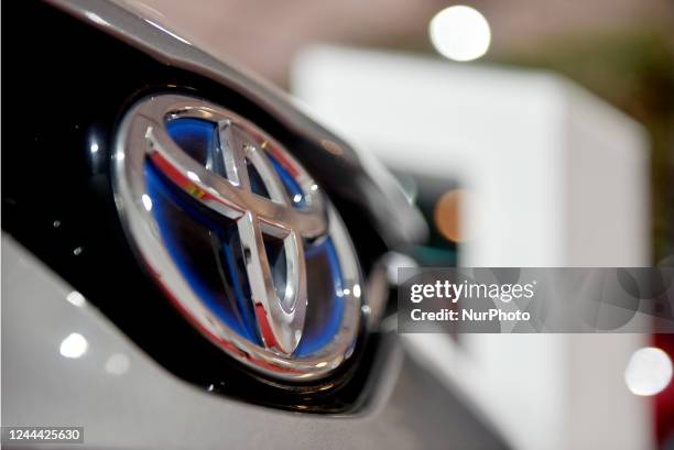 Japanese car maker Toyota logo is seen in an electric passenger vehicle which are on display at Global Investors Meet 2022, in Bangalore, India, 02...