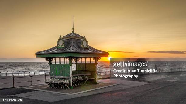 sunset over the sea - blackpool stock pictures, royalty-free photos & images