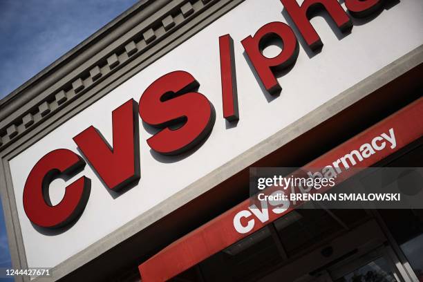 Sign for a CVS Pharmacy in Washington, DC, on November 2, 2022. CVS Health said they had agreed to pay approximately $5 billion over 10 years to...