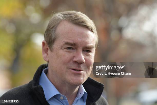 Sen. Michael Bennet answers questions from reporters after drop off his ballot at Washington Park in Denver, Colorado on Wednesday, November 2, 2022.