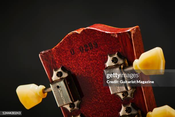 Detail of the headstock and Kluson Deluxe tuners on a vintage 1960 Gibson Les Paul Standard electric guitar, taken on November 26, 2020.