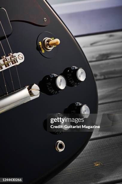 Detail of the pickup controls on an Epiphone Wilshire electric guitar with a Black finish, taken on December 1, 2020.