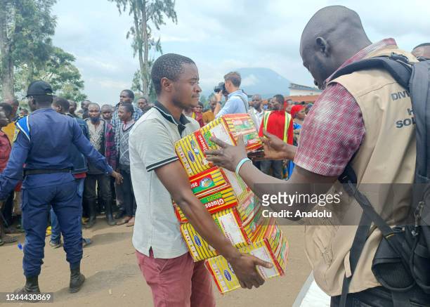 Congolese people receive humanitarian aid in Nyiragongo, Goma, the capital of North Kivu province in Democratic Republic of the Congo on November 02,...