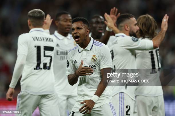 Real Madrid's Brazilian forward Rodrygo celebrates with teammates after scoring his team's second goal during the UEFA Champions League 1st round day...