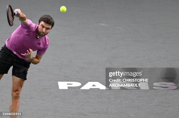 France's Gilles Simon serves during the men's singles round of 16 tennis match between US' Taylor Fritz and France's Gilles Simon on day three of the...