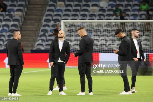 Benfica's players inspect the pitch ahead of the UEFA Champions League group H football match between Israel's Maccabi Haifa and Portugal's Benfica...