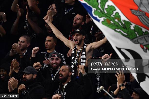 Juventus' supporters gesture prior to the UEFA Champions League 1st round day 6 group H football match between Juventus Turin and Paris Saint-Germain...