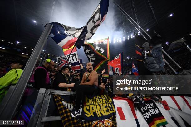 S supporters wave flags prior to the UEFA Champions League 1st round day 6 group H football match between Juventus Turin and Paris Saint-Germain at...