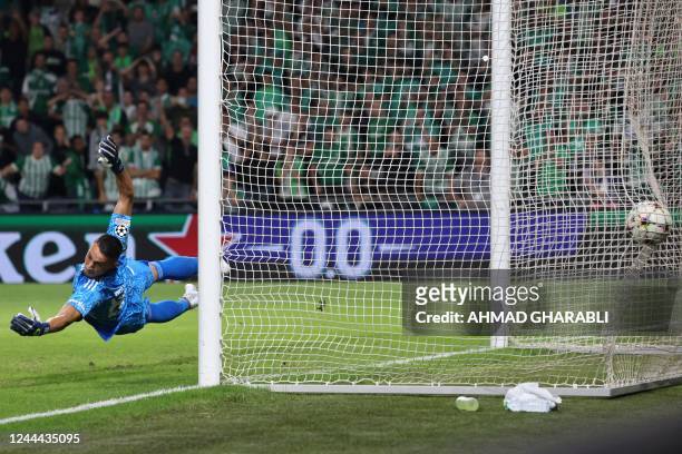 Benfica's Greek goalkeeper Odysseas Vlachodimos concedes a goal during the UEFA Champions League group H football match between Israel's Maccabi...