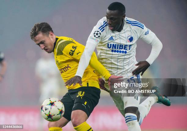 Dortmund's German midfielder Felix Passlack and FC Copenhagen's Danish forward Mohammed Daramy vie for the ball during the UEFA Champions League...