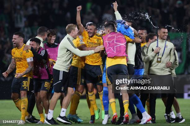 Benfica's players celebrate their victory in the UEFA Champions League group H football match between Israel's Maccabi Haifa and Portugal's Benfica...