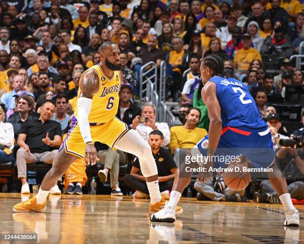 LeBron James of the Los Angeles Lakers guards Kawhi Leonard of the LA Clippers during the game on October 20, 2022 at Crypto.com Arena in Los...