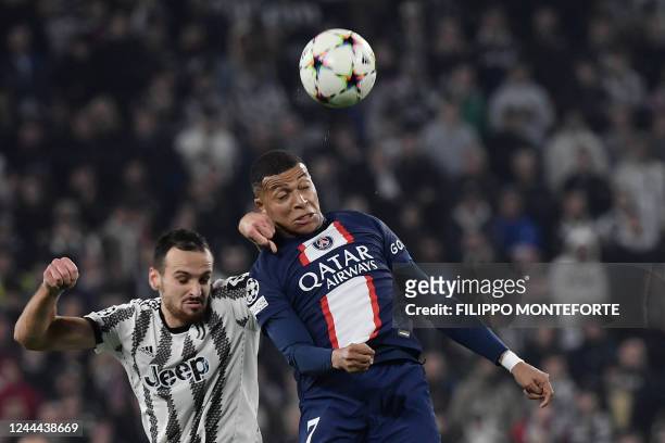 Paris Saint-Germain's French forward Kylian Mbappe heads the ball during the UEFA Champions League 1st round day 6 group H football match between...
