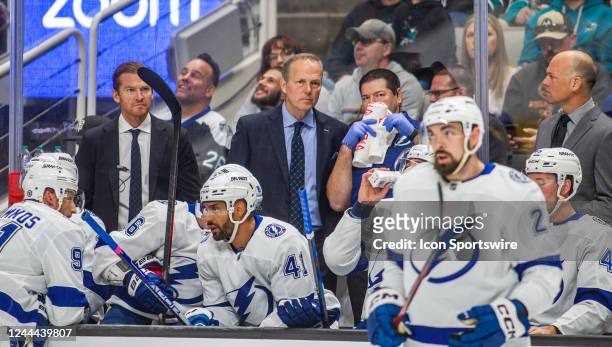 Tampa Bay Lightning head coach Jon Cooper, center, on his bench during the first period of a regular season NHL hockey game between the Tampa Bay...