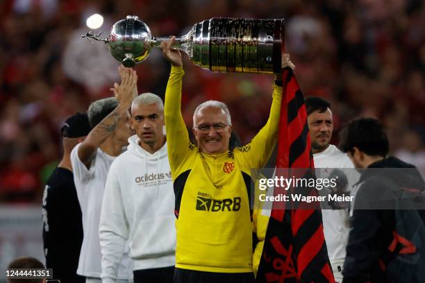 Dorival Junior coach of Flamengo lifts the Libertadores trophy before a match between Flamengo and Corinthians as part of Brasileirao 2022 at...