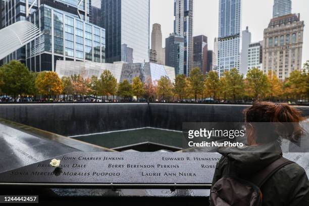 Flower is seen placed on the names of victims at the South Tower Memorial Pool, known as 'Reflecting Absence', by architect Michael Arad and...