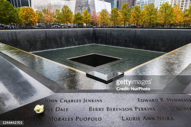 Flower is seen placed on the names of victims at the South Tower Memorial Pool, known as 'Reflecting Absence', by architect Michael Arad and...