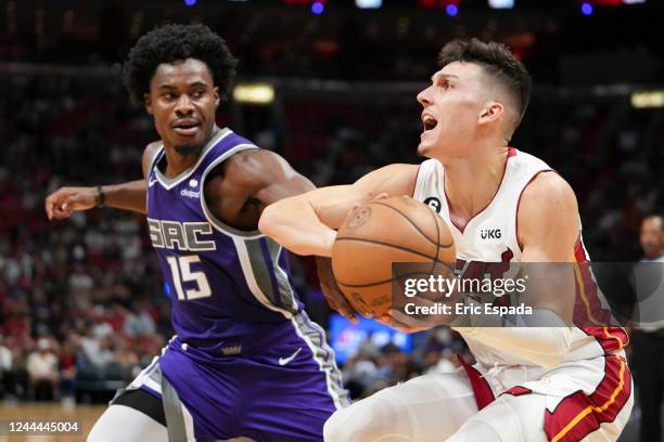 Tyler Herro of the Miami Heat drives against Davion Mitchell of the Sacramento Kings during the second half at FTX Arena on November 2, 2022 in...