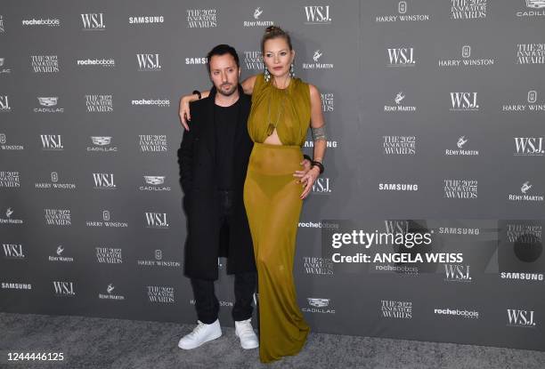 Italian fashion designer Anthony Vaccarello and British model Kate Moss arrives for the Wall Street Journal Magazine 2022 Innovator awards at the...