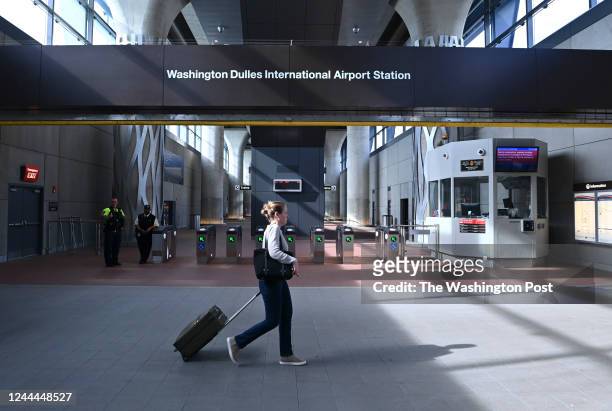 Passenger walks past the entrance to the new Silver Line Metro station at Washington Dulles International Airport on November 2, 2022 in Dulles, Va.