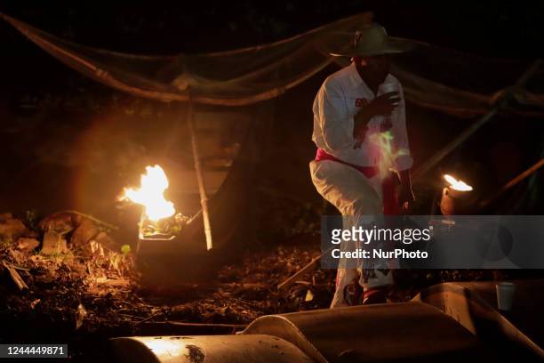 Fisherman from Isla de Janitzio, located in the state of Michoacán, Mexico, gets ready to board a canoe with a gasoline-powered sail prior to a trip...