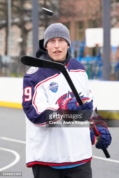 Patrik Laine of the Columbus Blue Jackets flips a puck as he visits a childhood outdoor rink prior to the 2022 NHL Global Series Finland between the...