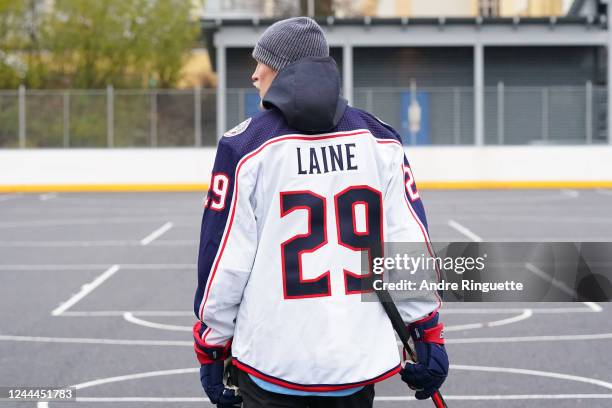 Patrik Laine of the Columbus Blue Jackets visits a childhood outdoor rink prior to the 2022 NHL Global Series Finland between the Colorado Avalanche...