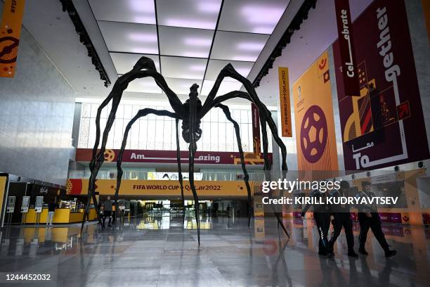 Policemen walk inside the Main Media Center in Doha on November 3 ahead of the Qatar 2022 FIFA World Cup football tournament.