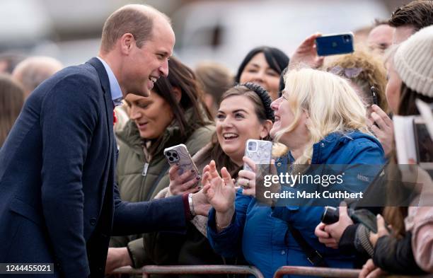 Prince William, Prince of Wales meets members of the public and takes selfies after a visit to The Street - a community hub that helps local...