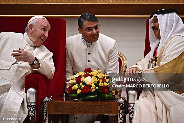 Pope Francis speaks with Bahrain's King Hamad bin Isa al-Khalifa during their meeting in Awali, south of the Bahraini capital Manama, on November 3,...