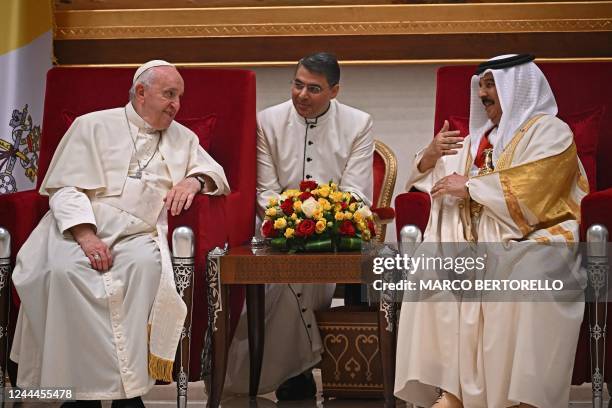 Pope Francis speaks with Bahrain's King Hamad bin Isa al-Khalifa during their meeting in Awali, south of the Bahraini capital Manama, on November 3,...