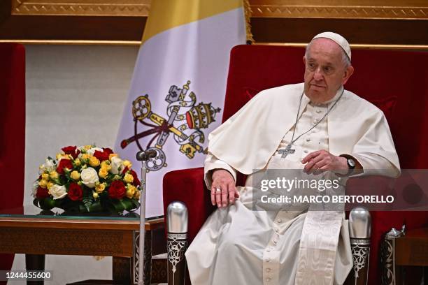 Pope Francis looks on during his meeting with Bahrain's king in Awali, south of the Bahraini capital Manama, on November 3, 2022.