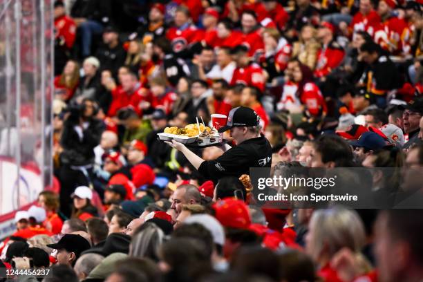 Food is delivered to fans during the second period of an NHL game between the Calgary Flames and the Seattle Kraken on November 1 at the Scotiabank...