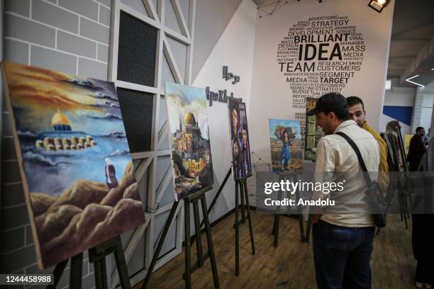 Palestinians attend the opening of the exhibition to mark the 105th anniversary of Balfour Declaration, which was a public statement issued by the...