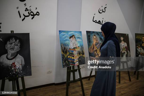 Palestinians attend the opening of the exhibition to mark the 105th anniversary of Balfour Declaration, which was a public statement issued by the...