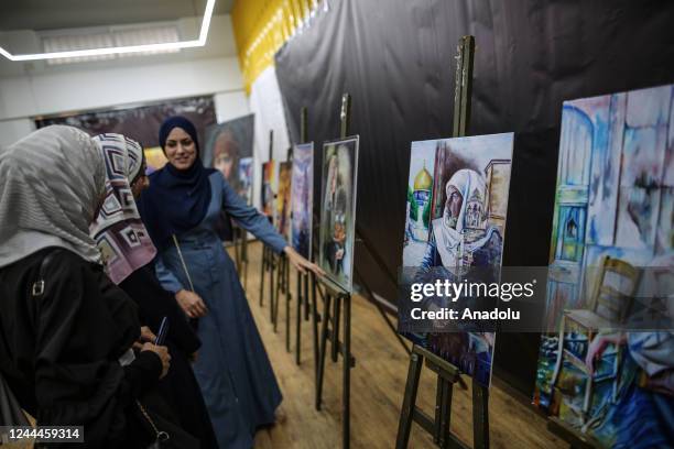 Palestinians attend the opening of the exhibition to mark the 105th anniversary of Balfour Declaration, which was a public statement issued by the...