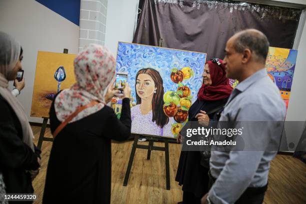 Palestinians attend the opening of the exhibition to mark the 105th anniversary of Balfour Declaration, which was a public statement issued by the...