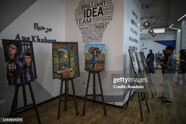 Palestinians attend the opening of the exhibition to mark the 105th anniversary of Balfour Declaration, which was a public statement issued by the...