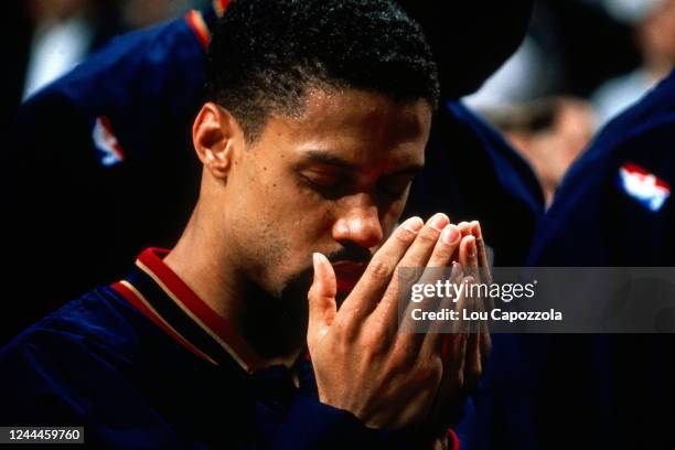 Mahmoud Abdul-Rauf of the Denver Nuggets prays during the National Anthem prior to the game agains the Philadelphia 76ers on December 11, 1995 at...