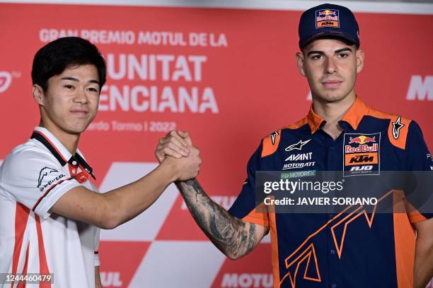 Moto2 rider Kalex Idemitsu Honda Team Asia Japanese Ai Ogura and Kalex Red Bull KTM Ajo Spanish rider Augusto Fernandez shake hands during a press...