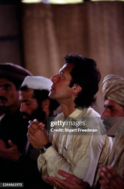 Imran Khan the former Pakistan International Cricket player at prayer in a mosque on 17th July 1999 in Lahore, Pakistan.