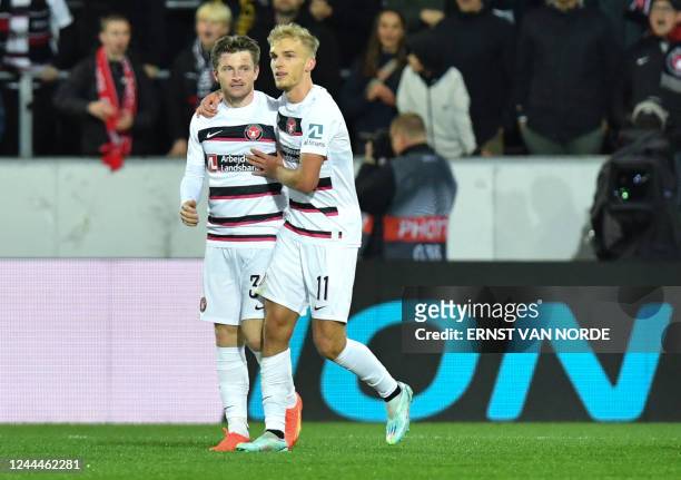 Midtjylland's Danish forward Anders Dreyer celebrates with Midtjylland's Danish forward Gustav Isaksen scoring his team's first goal during the UEFA...