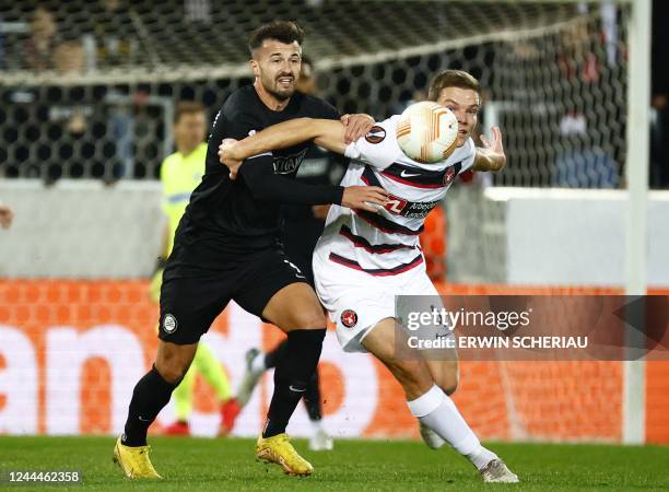 Sturm Graz's Swiss forward Albian Ajeti and Midtjylland's Danish defender Stefan Gartenmann vie for the ball during the UEFA Europa League Group F...