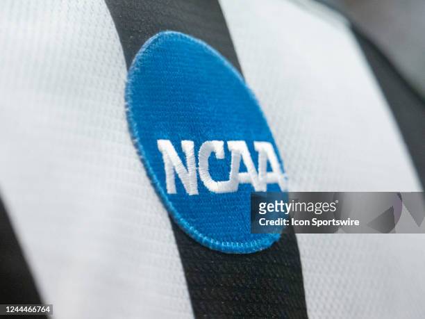 View of the NCAA logo on the back of a Big Ten Conference referee's uniform during a men's college hockey game between the Michigan State Spartans...